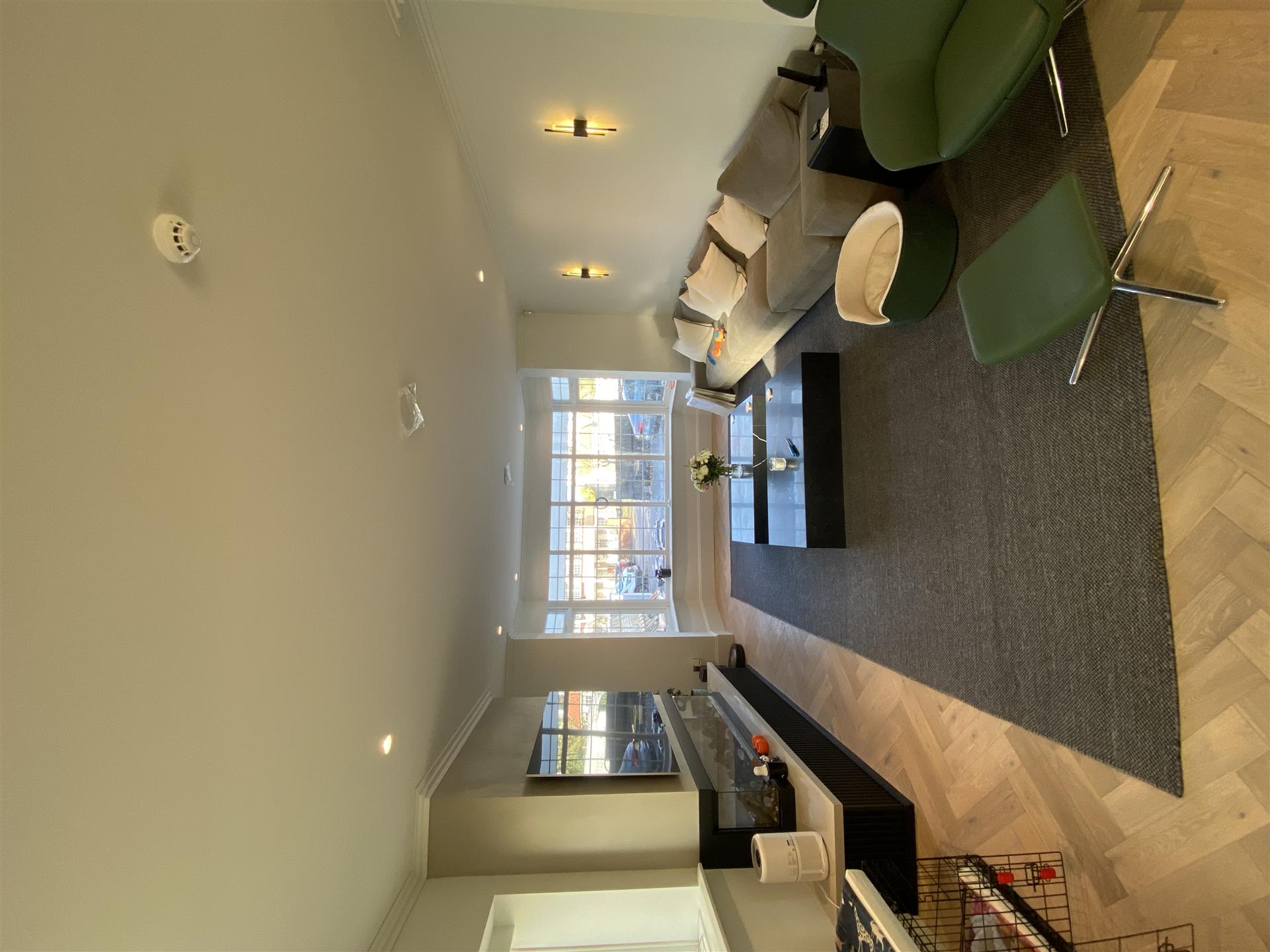 Living room with herringbone parquet floor, neutral palette, Essex